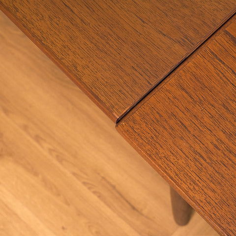 Danish dining table in teak and walnut