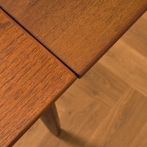 Danish dining table in teak and walnut
