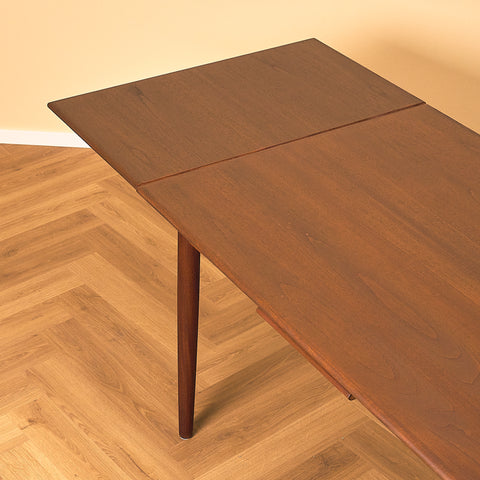 Danish dining table in teak and walnut