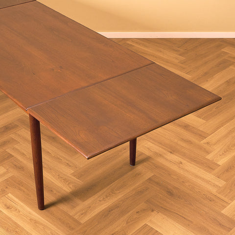 Danish dining table in teak and walnut