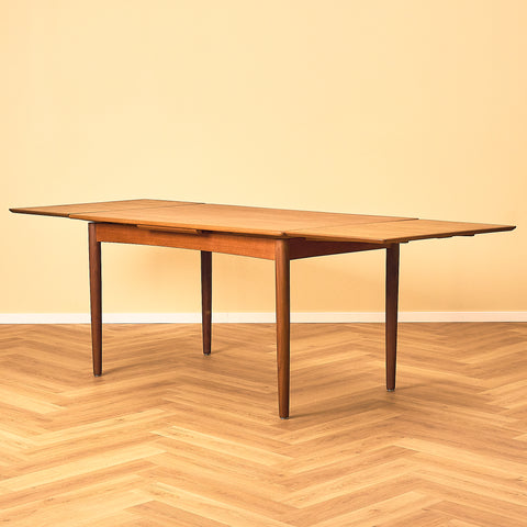 Danish dining table in teak and walnut