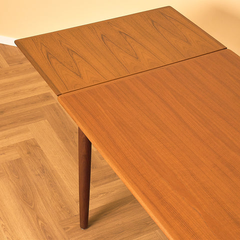 Danish dining table in teak and walnut