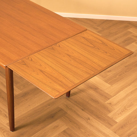 Danish dining table in teak and walnut