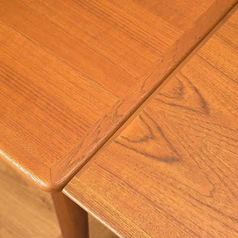 Danish dining table in teak and walnut