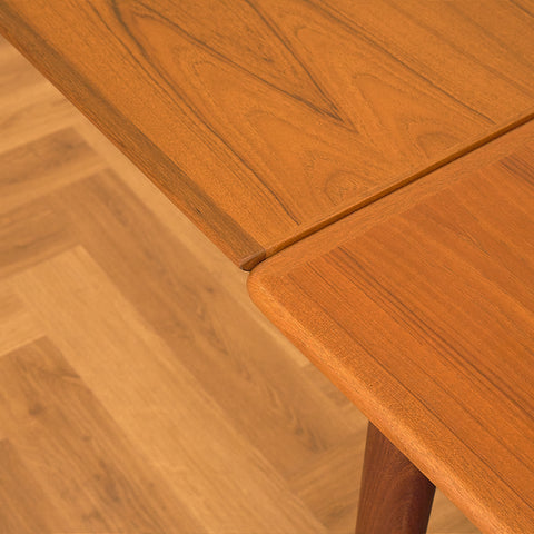 Danish dining table in teak and walnut