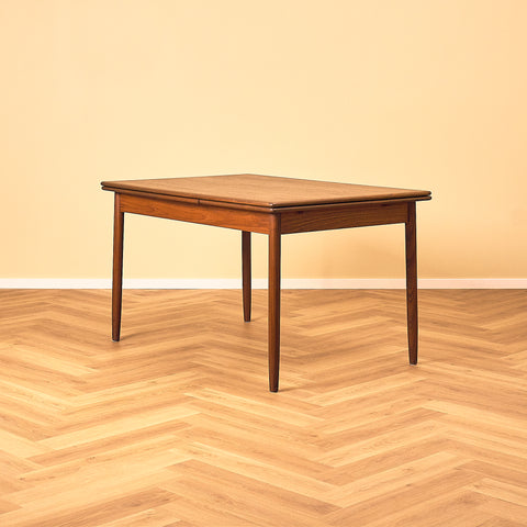 Danish dining table in teak and walnut