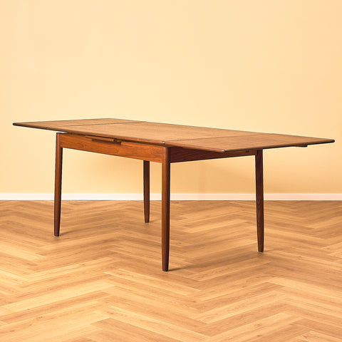 Danish dining table in teak and walnut