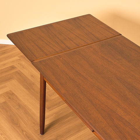 Danish dining table in teak and walnut