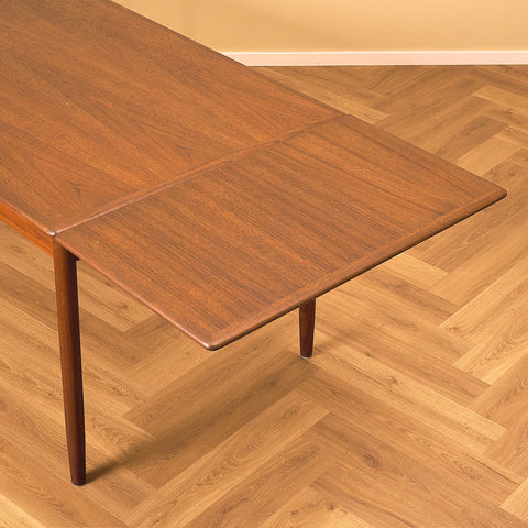 Danish dining table in teak and walnut