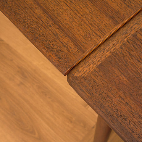 Danish dining table in teak and walnut
