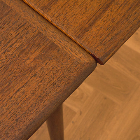 Danish dining table in teak and walnut