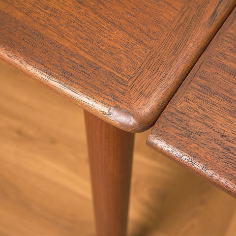 Danish dining table in teak and walnut