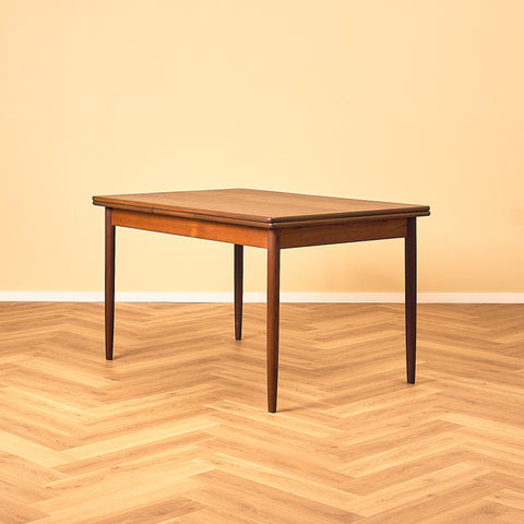 Danish dining table in teak and walnut