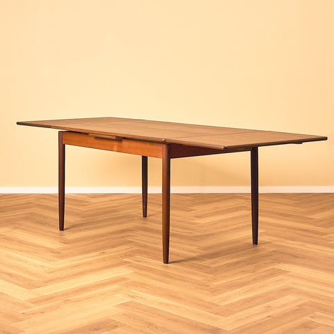 Danish dining table in teak and walnut
