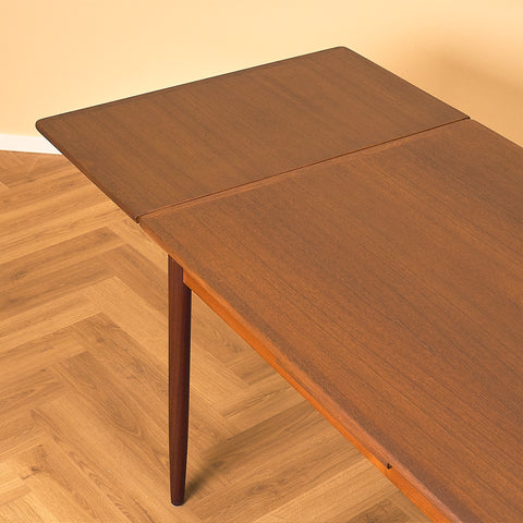 Danish dining table in teak and walnut