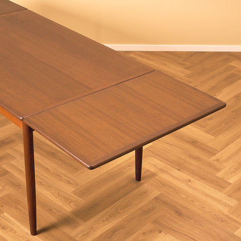 Danish dining table in teak and walnut