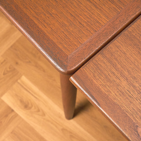 Danish dining table in teak and walnut