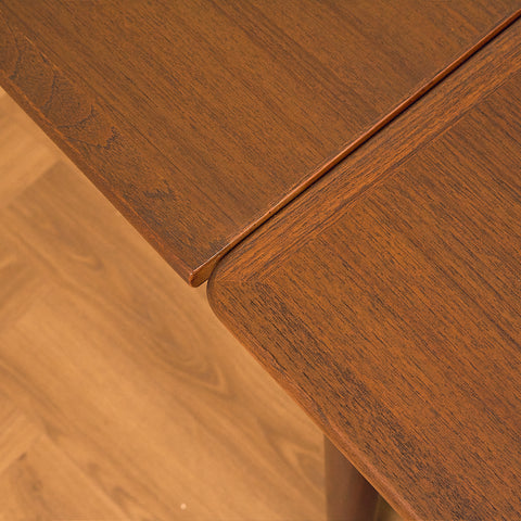 Danish dining table in teak and walnut