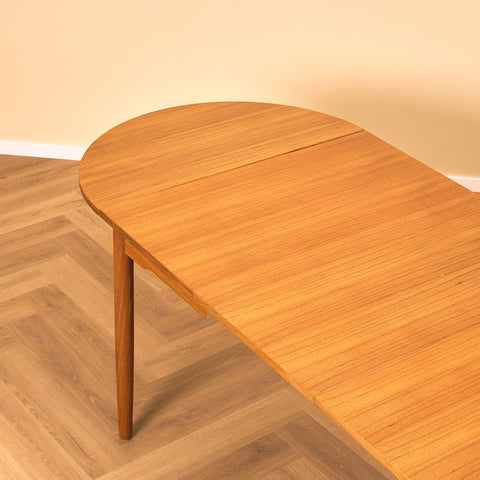 Danish dining table with 4 extensions in teak "Arne Vodder style"