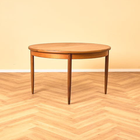 British round dining table in walnut and teak by G-Plan