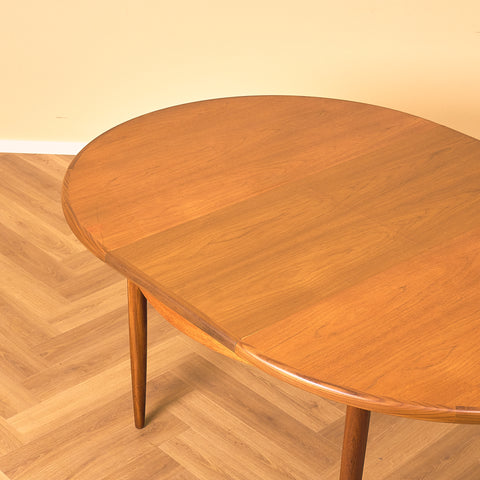 British round dining table in walnut and teak by G-Plan