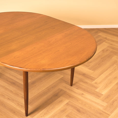 British round dining table in walnut and teak by G-Plan