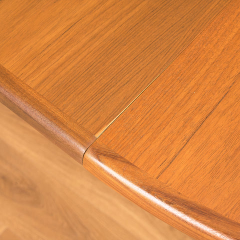 British round dining table in walnut and teak by G-Plan