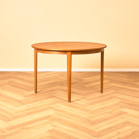 Swedish round dining table in teak and beech