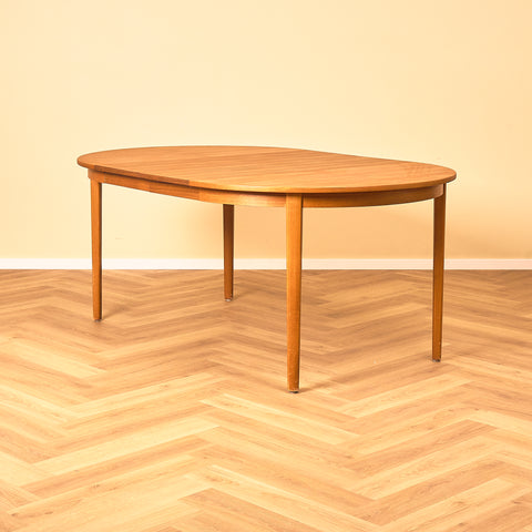 Swedish round dining table in teak and beech