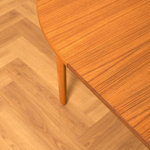 Swedish round dining table in teak and beech