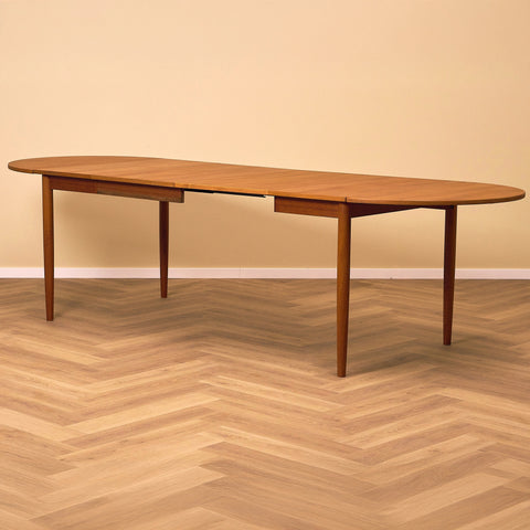 Danish dining table with 4 extensions in teak "Arne Vodder style"