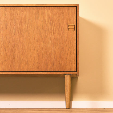 Danish Oak Sideboard with Sliding Doors, close-up of the door and leg in oak