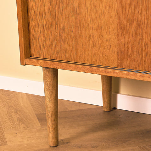 Danish Oak Sideboard with Sliding Doors, close-up of the tapered legs in oak