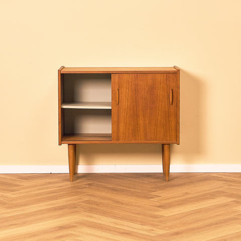 Swedish Teak Cabinet with Sliding Doors, front view with the left door slid open