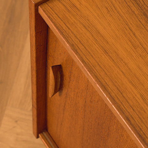 Swedish Teak Cabinet with Sliding Doors, close-up of the carved handle in teak